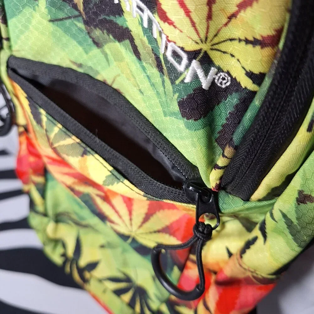 Vibedration Hydration Backpack w/o bladder - green, orange, black leaves - used
